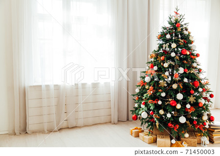 Christmas decor home window the interior of the Christmas tree with gifts for the new year Christmas decor home window the interior of the Christmas tree with gifts for the new year 71450003