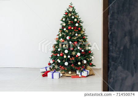 Christmas tree pine with gifts interior decor new year 71450074