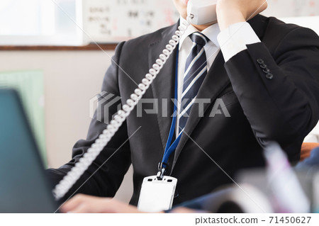 A man who makes a phone call A man who makes a phone call 71450627