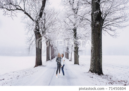 Women in winter scene 71450804