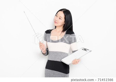 A woman showing a point with a pointer A woman showing a point with a pointer 71451566