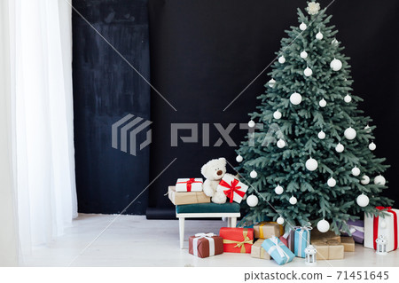 Christmas tree pine with gifts new year decor black background 71451645