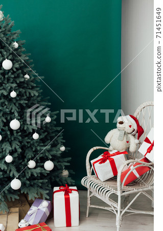 Christmas tree pine with gifts new year decor green background Christmas tree pine with gifts new year decor green background 71451649