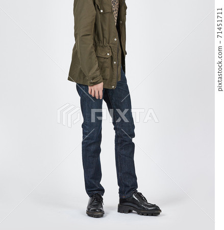 Standing man wearing blue skinny jeans, slim body Standing man wearing blue skinny jeans, slim body 71451711