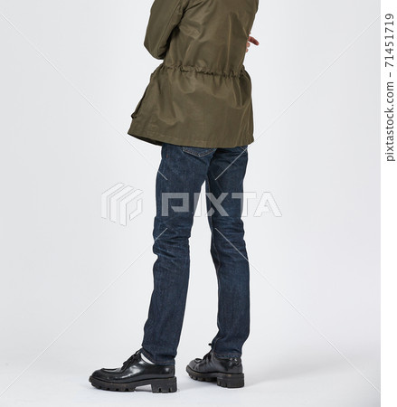 Standing man wearing blue skinny jeans, slim body Standing man wearing blue skinny jeans, slim body 71451719