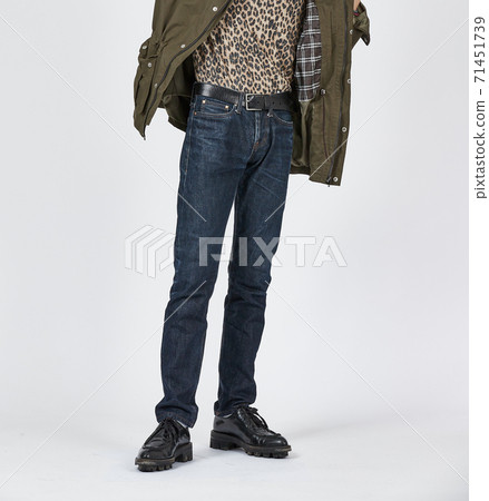 Standing man wearing blue skinny jeans, slim body Standing man wearing blue skinny jeans, slim body 71451739