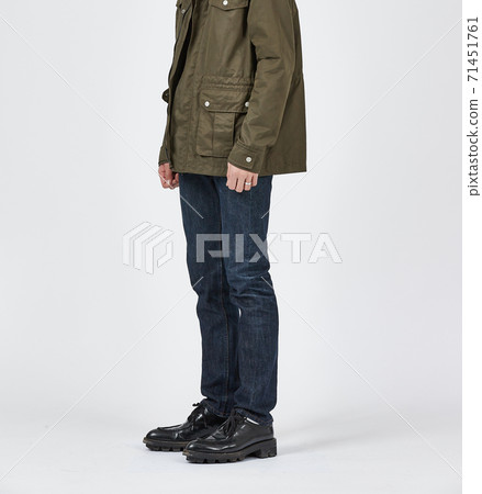 Standing man wearing blue skinny jeans, slim body 71451761