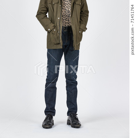 Standing man wearing blue skinny jeans, slim body Standing man wearing blue skinny jeans, slim body 71451764