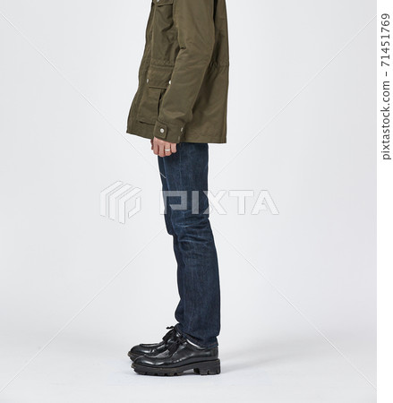 Standing man wearing blue skinny jeans, slim body 71451769