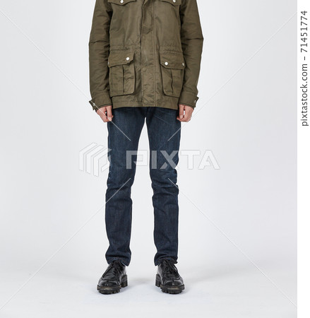 Standing man wearing blue skinny jeans, slim body Standing man wearing blue skinny jeans, slim body 71451774