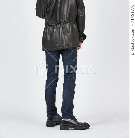 Standing man wearing blue skinny jeans, slim body 71451776