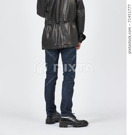 Standing man wearing blue skinny jeans, slim body 71451777