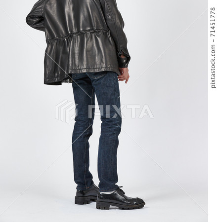 Standing man wearing blue skinny jeans, slim body Standing man wearing blue skinny jeans, slim body 71451778