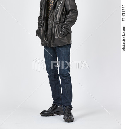 Standing man wearing blue skinny jeans, slim body Standing man wearing blue skinny jeans, slim body 71451783