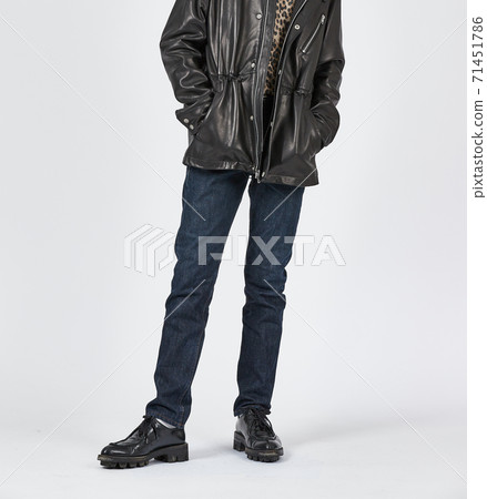 Standing man wearing blue skinny jeans, slim body 71451786