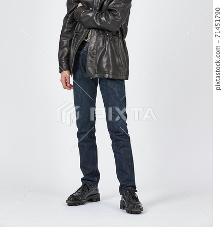 Standing man wearing blue skinny jeans, slim body 71451790