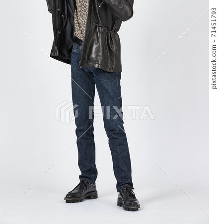 Standing man wearing blue skinny jeans, slim body 71451793