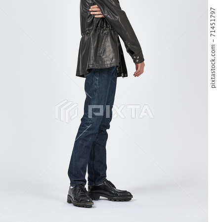 Standing man wearing blue skinny jeans, slim body 71451797