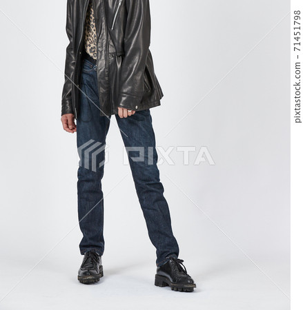 Standing man wearing blue skinny jeans, slim body Standing man wearing blue skinny jeans, slim body 71451798