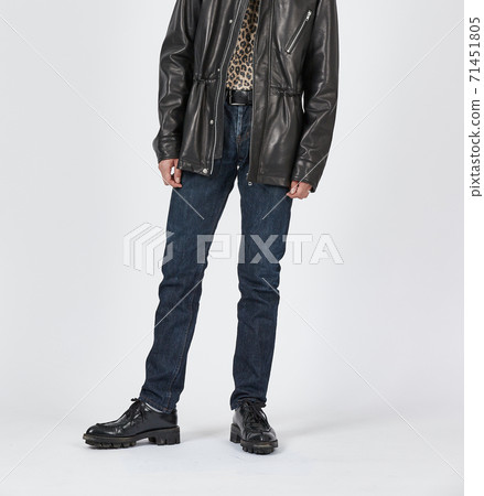 Standing man wearing blue skinny jeans, slim body Standing man wearing blue skinny jeans, slim body 71451805
