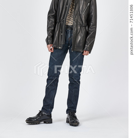 Standing man wearing blue skinny jeans, slim body Standing man wearing blue skinny jeans, slim body 71451806
