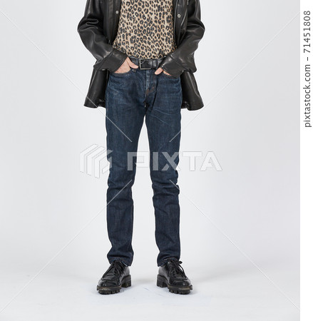 Standing man wearing blue skinny jeans, slim body 71451808