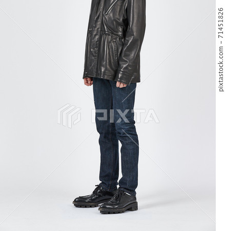 Standing man wearing blue skinny jeans, slim body Standing man wearing blue skinny jeans, slim body 71451826