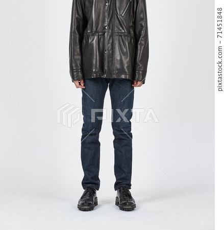 Standing man wearing blue skinny jeans, slim body Standing man wearing blue skinny jeans, slim body 71451848
