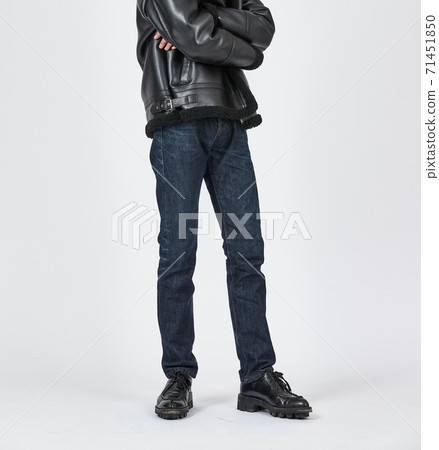 Standing man wearing blue skinny jeans, slim body 71451850