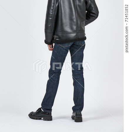 Standing man wearing blue skinny jeans, slim body 71451852