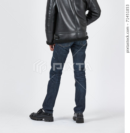 Standing man wearing blue skinny jeans, slim body 71451853