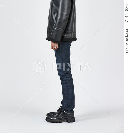 Standing man wearing blue skinny jeans, slim body Standing man wearing blue skinny jeans, slim body 71451886