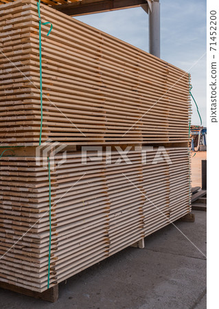 Stack of chopped planks ready to be shipped. Lumber industry. Woodworking factory. 71452200