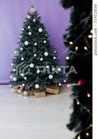 Christmas tree pine with gifts new year decor purple background 2021 2022 71452939