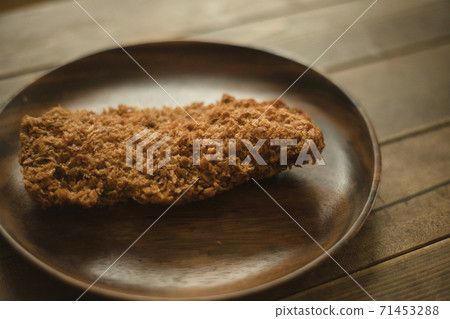 Milk cutlet on a wooden plate Milk cutlet on a wooden plate 71453288