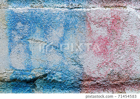 A fragment of colorful graffiti painted on a brick wall. Abstract backdrop for design. A fragment of colorful graffiti painted on a brick wall. Abstract backdrop for design. 71454583