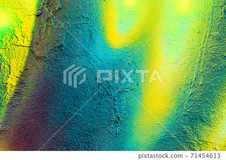 A fragment of colorful graffiti painted on a concrete wall. Abstract urban backdrop for design. 71454613