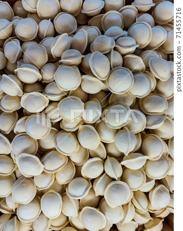lots of frozen prefabricated dumplings for cooking as a background 71455716