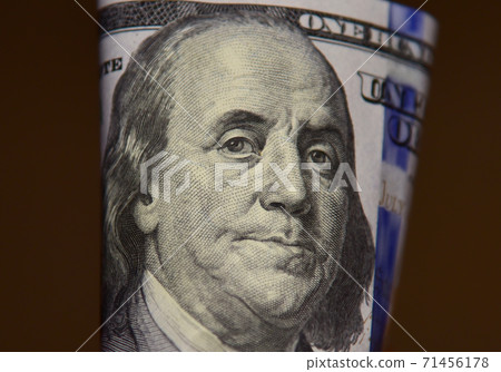Face of the Benjamin Franklin on US hundred closeup. 100 dollars bill , united states money  71456178