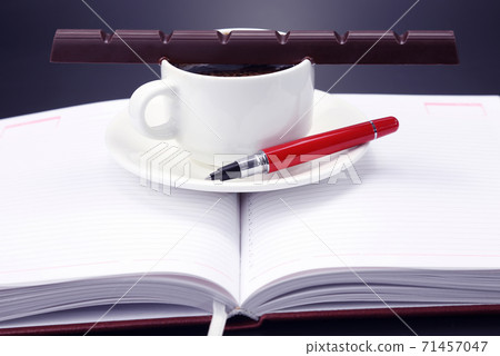 black coffee and chocolate on the table from a business person 71457047