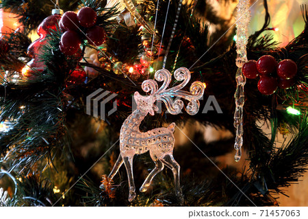 decorations and festive toys on the christmas tree 71457063