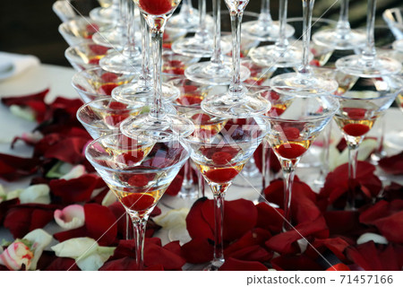 many of the champagne glasses stacked on top of each other 71457166