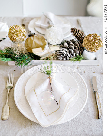 Scandinavian style table set for Christmas dinner. 71457951