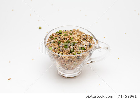 Miscellaneous grain in transparent glass cup isolated on white background Miscellaneous grain in transparent glass cup isolated on white background 71458961
