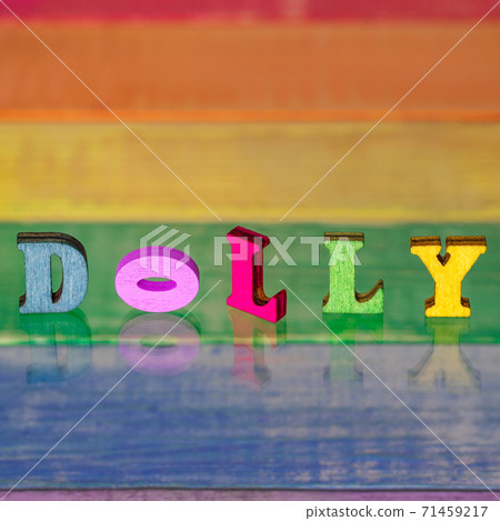 inscription dolly on background of lgbt flag made of wood inscription dolly on background of lgbt flag made of wood 71459217