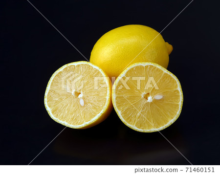 Citrus fruits. cut in half lemons on a dark background Citrus fruits. cut in half lemons on a dark background 71460151