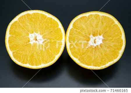 Citrus fruit sliced orange fruit on a dark background Citrus fruit sliced orange fruit on a dark background 71460165