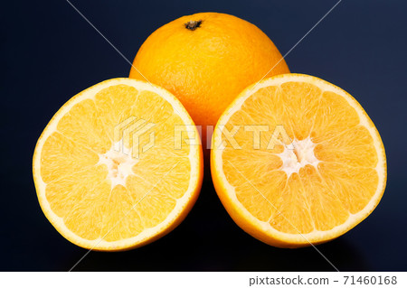 Citrus fruit sliced orange fruit on a dark background Citrus fruit sliced orange fruit on a dark background 71460168