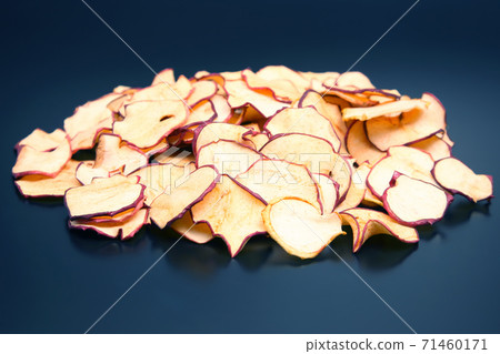 Dried Apple slices on dark background Dried Apple slices on dark background 71460171
