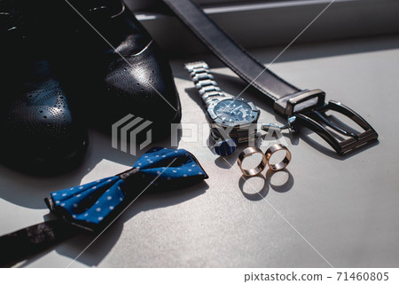Wedding rings. Black leather shoes, watch, blue 71460805